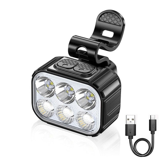 A rechargeable bicycle bike light with multiple LED lights on the front, with a USB cable. The light is black in color and appears to be waterproof with a handlebar mount attached.