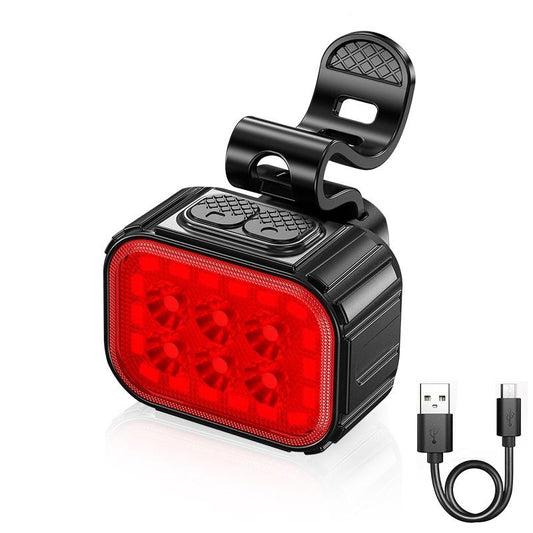 A black rechargeable 6 LED bike light with a front headlight and rear tail light, showing the LED lights and the USB charging cable.