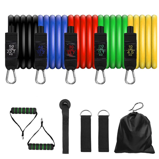 A set of colorful resistance bands with different resistance levels, accompanied by foam handles, ankle straps, and a door anchor, all laid out on a white background.
